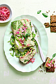 Lettuce terrine with salmon trout, avocado cream and pickled onions