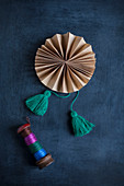 Hand-made paper rosette with tassels