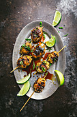 Asian Chicken Meatballs on Skewers with Limes