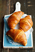 Croissants on a chopping board