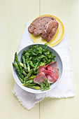 Swiss green asparagus salad with ham and walnut bread