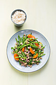 Colourful green bean salad with apricots and cooked ham
