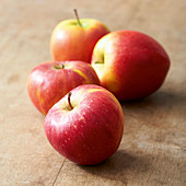 Four red and yellow apples