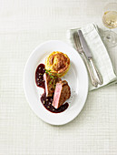 Veal steaks in red wine sauce with asparagus souffle
