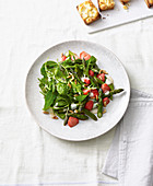 Asparagus and strawberry salad with tahini and lemon sauce