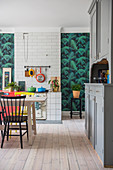 Accents of colour in kitchen with dining table and old dresser