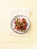 Bulgur salad with chickpeas and aubergine and pomegranate cream