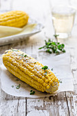 Grilled corn with cheese and marjoram