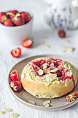 Strawberry and cheese bun with almond flakes