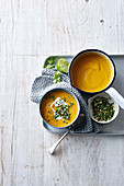 Pumpkin and lime soup with a peanut and coriander topping