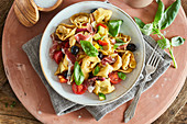 Colourful tortellini salad with Prosciutto and olives