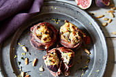Warm figs wrapped in ham with ricotta filling (seen from above)
