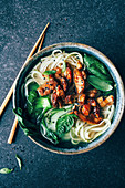 Noodle soup with spicy marinated chicken, basil, broccoli and bok choy (Asia)