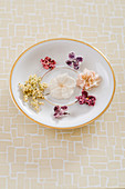 Candied flowers on a gold edged plate