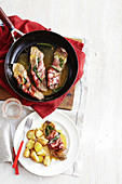 Veal saltimbocca with crunchy baked potatoes