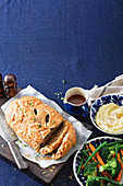 Beef Wellington with mashed potatoes and vegetables