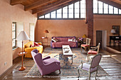 Various chairs and upholstered furnishings in living room