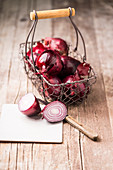 Red onions in a wire basket
