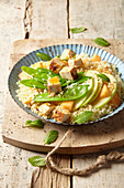 Couscous salad with chicken, apple, cantaloupe melon, and mangetout