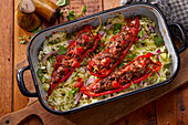 Pointed peppers filled with minced meat on a bed of cabbage