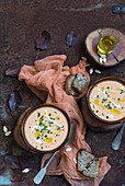 Cream of pumpkin soup with herbs and olive oil
