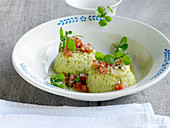 Mashed potatoes and watercress with tomatoes and spring onions