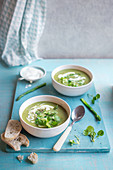 Asparagus and watercress soup with sour cream and bread