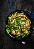 Vegetable penne with green asparagus and feta cheese