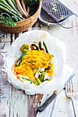 Fish en papillote with spring vegetables