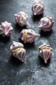 Meringues made of aquafaba and filled with caramel cream
