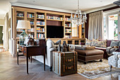 Sofa and fitted cupboards in elegant, classic living room