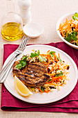 Cumin pork chops with rice and carrot salad