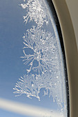 Ice crystals on aircraft window