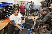 Disable workers assembling wheelchair, Mexico