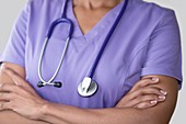 Female doctor in purple top with stethoscope