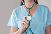 Female doctor holding stethoscope