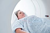 Female patient in MRI scanner