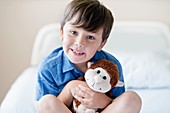 Boy in hospital with teddy bear