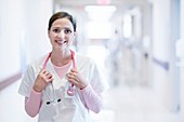 Nurse smiling towards camera with stethoscope