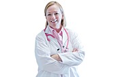 Mature nurse smiling with arms folded