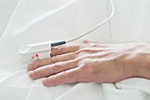 Patient's hand with pulse oximeter