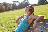 Young woman listening to music from smart phone
