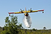 Aircraft dropping fire retardant