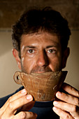 Archaeologist with a talaiotic cup, Menorca