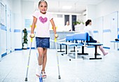 Girl walking with crutches