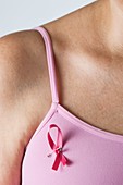 Woman wearing breast cancer awareness ribbon