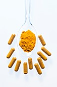 Turmeric supplement capsules and powder