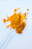 Turmeric powder on spoon