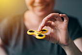 Woman playing with fidget spinner