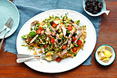Lentil and spinach salad with smoked mackerel, prunes and cherry tomatoes